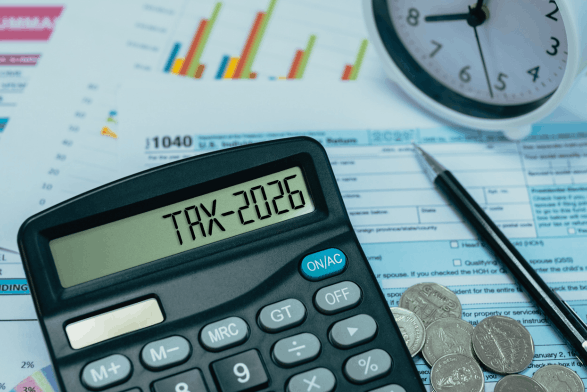 calculator that says "tax-2026" with tax documents in the background